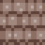 A 16×16 cobblestone tile rendered at native 1× scale — every pixel has to carry weight because there are only 256 total.